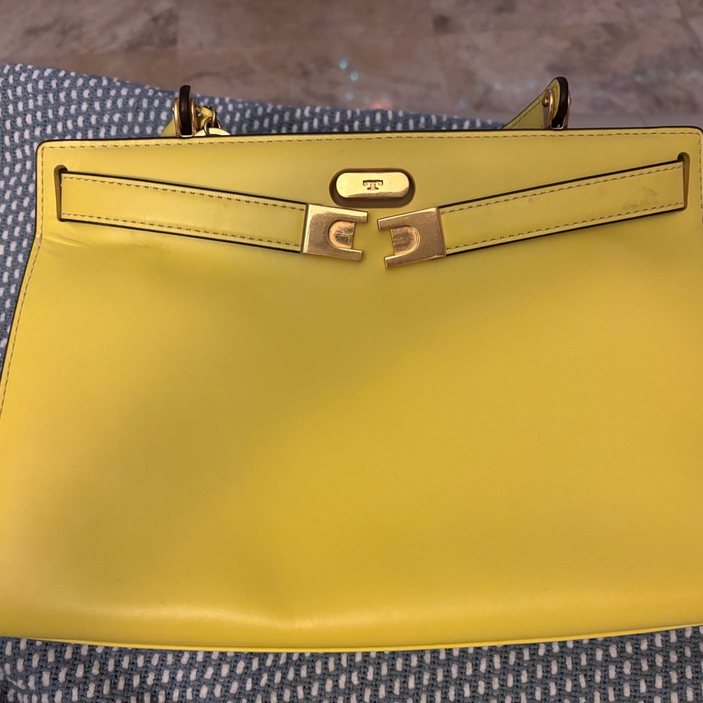 Brand New Tory Burch New York purse with a soft plastic cover for protection.